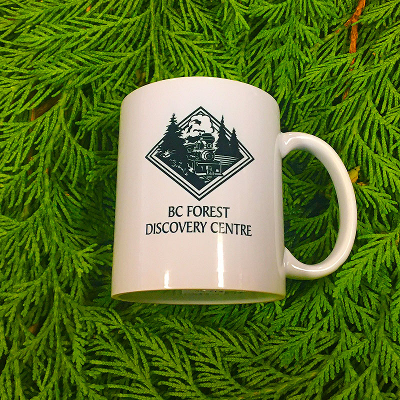 Our mug featuring the BC Forest Discovery Centre logo on one side and the 'Full Steam Ahead' graphic on the opposite side. Microwave and dishwasher safe.